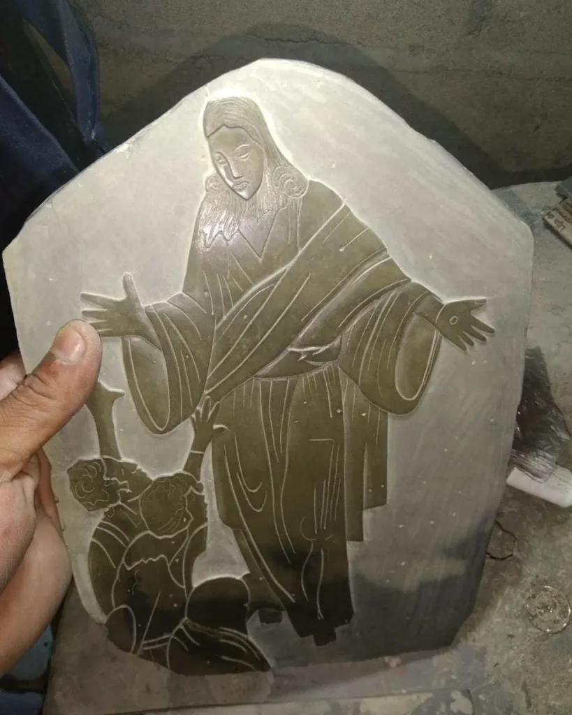 Stone Carvings of Jesus Hands Out to the Sides